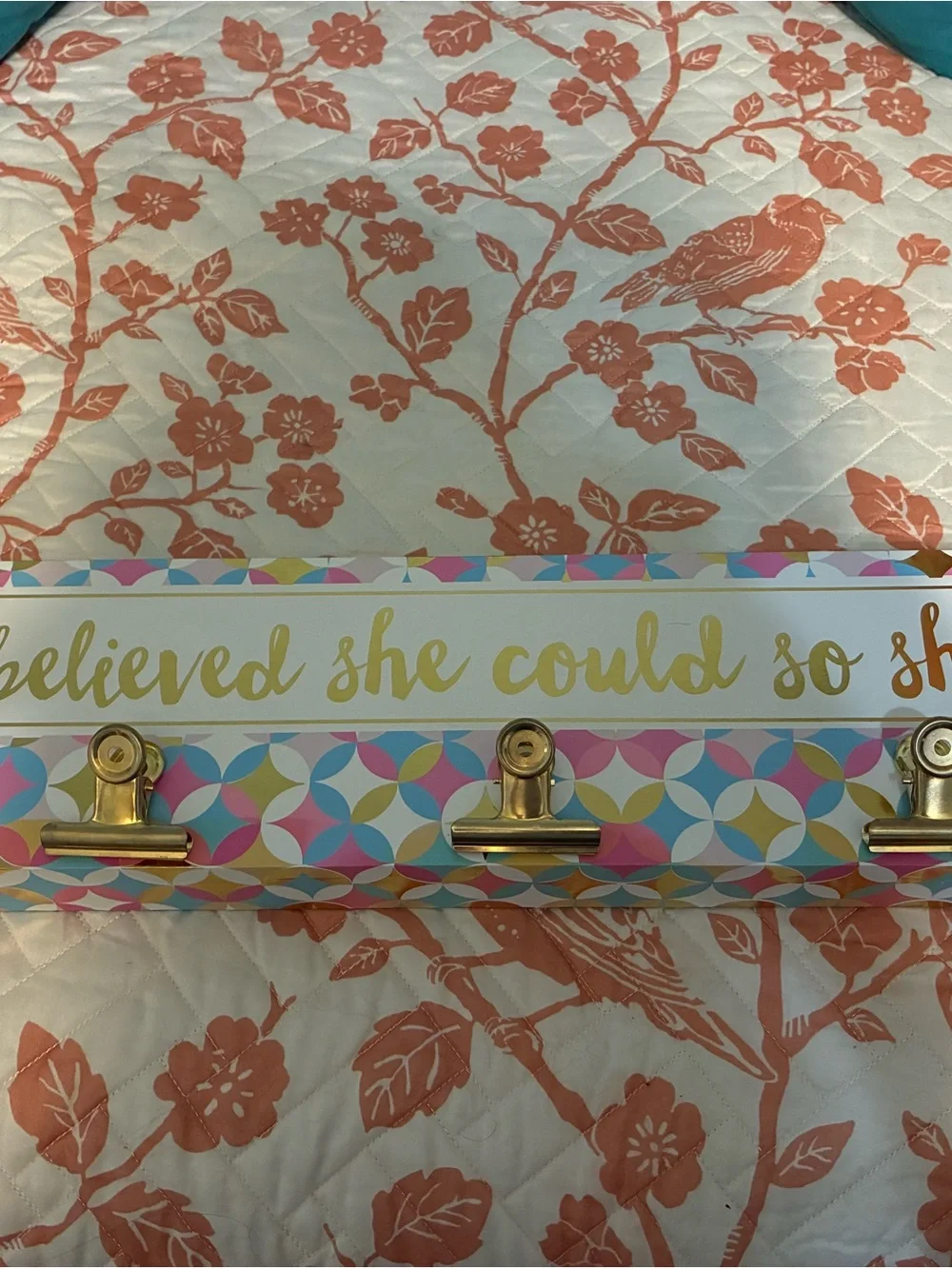 Gold Clip Wall Hook hanging with Pink, Blue & Yellow Pattern